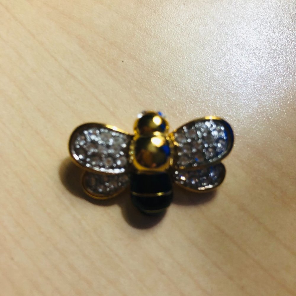 Bee brooch with rhinestones, gold tones and black enamel